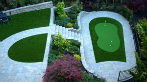 paverstones with synthetic lawn putting green