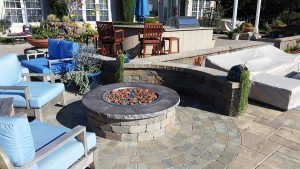 Paver stones outdoor fireplace step wall seating patio