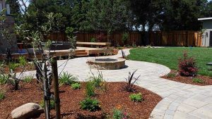 Paver stones outdoor fireplace step wall seating patio