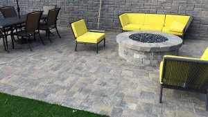 Paver stones outdoor fireplace step wall seating patio