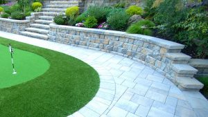 paver wall and putting green