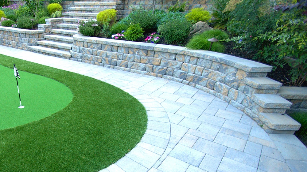 paver wall and putting green