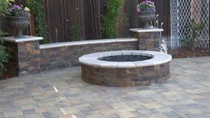 Paver stones outdoor fireplace step wall seating patio