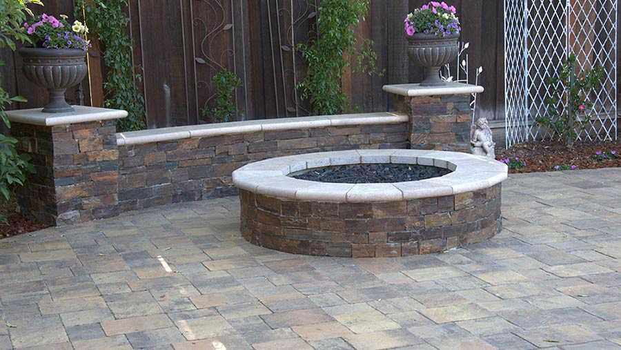 Paver stones outdoor fireplace step wall seating patio