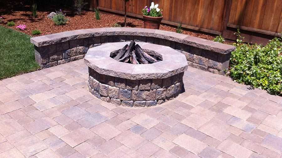 Paver stones outdoor fireplace step wall seating patio