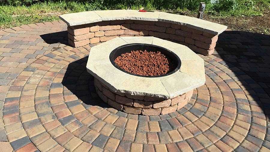 Paver stones outdoor fireplace step wall seating patio