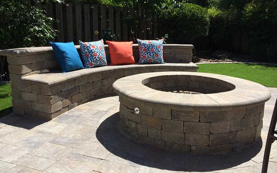 Paver stones outdoor fireplace step wall seating patio