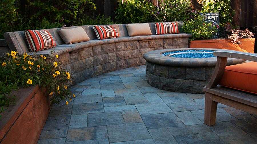 Paver stones outdoor fireplace step wall seating patio