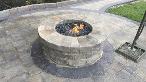 Paver stones outdoor fireplace step wall seating patio