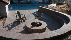Paver stones outdoor fireplace step wall seating patio