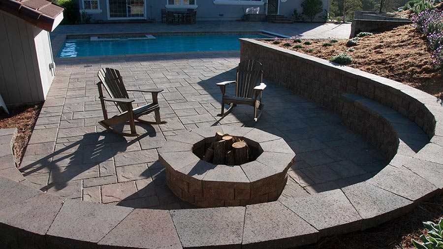 Paver stones outdoor fireplace step wall seating patio