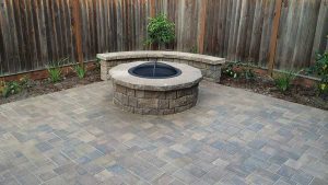 Paver stones outdoor fireplace step wall seating patio