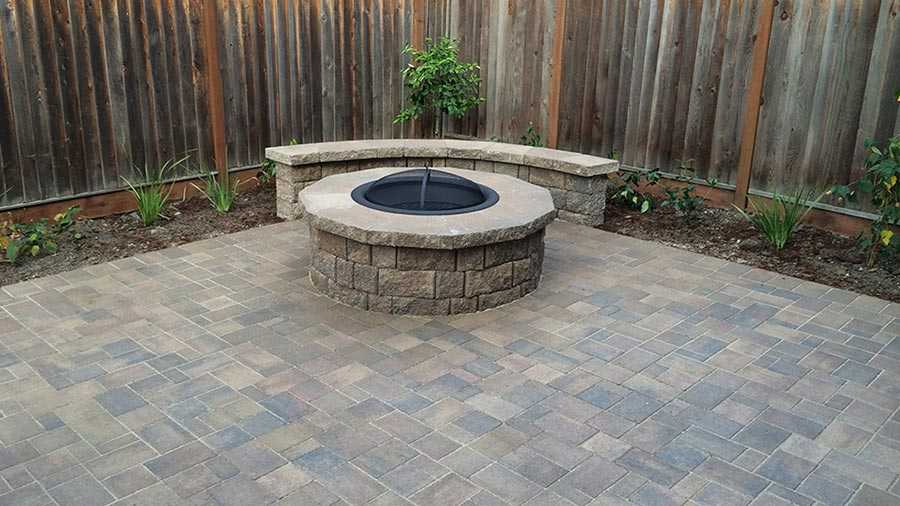 Paver stones outdoor fireplace step wall seating patio