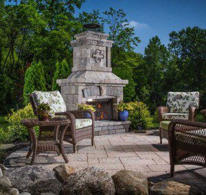 Paver stones outdoor fireplace step wall seating patio