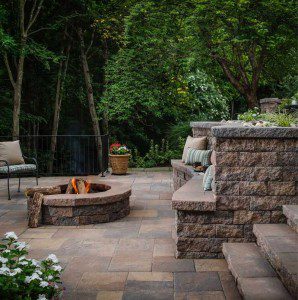 Paver stones outdoor fireplace step wall seating patio