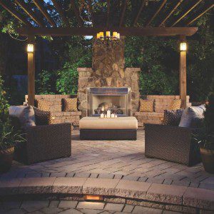 Paver stones outdoor fireplace step wall seating patio pergola