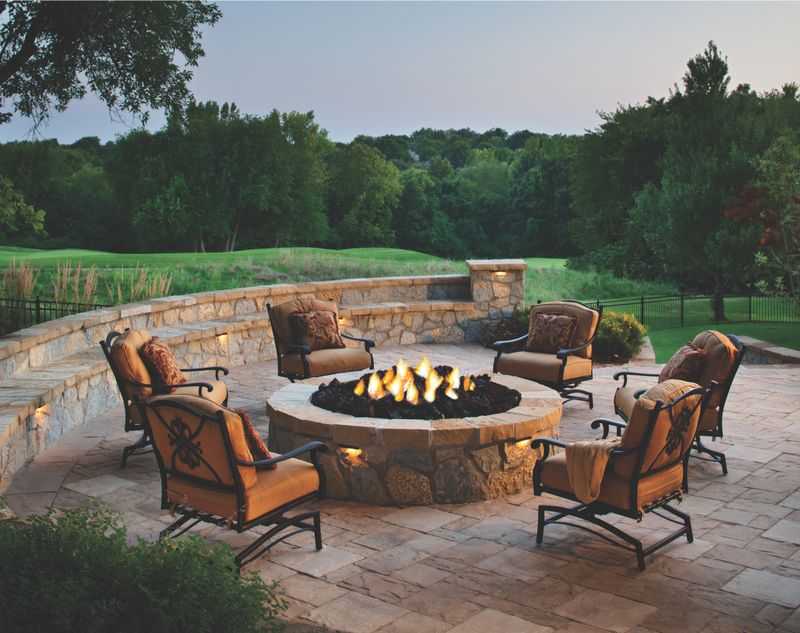 Paver stones outdoor fireplace step wall seating patio