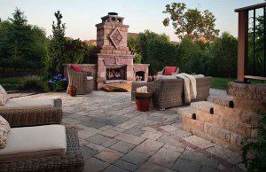 Paver stones outdoor fireplace step wall seating patio