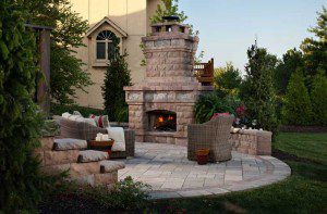Paver stones outdoor fireplace step wall seating patio