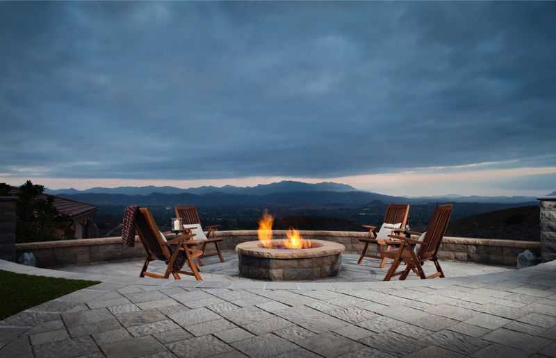 Paver stones outdoor fireplace step wall seating patio