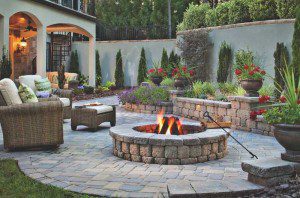 Paver stones outdoor fireplace step wall seating patio
