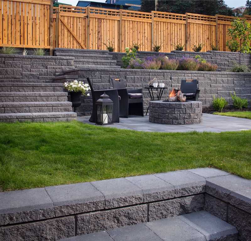 Paver stones outdoor fireplace step wall seating patio