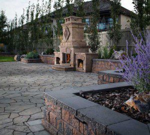 Paver stones outdoor fireplace step wall seating patio