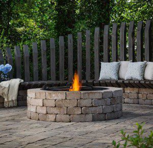 Paver stones outdoor fireplace step wall seating patio