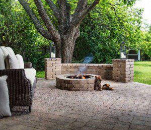 Paver stones outdoor fireplace step wall seating patio