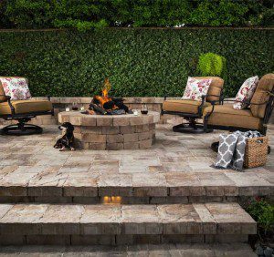 Paver stones outdoor fireplace step wall seating patio
