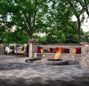 Paver stones outdoor fireplace step wall seating patio