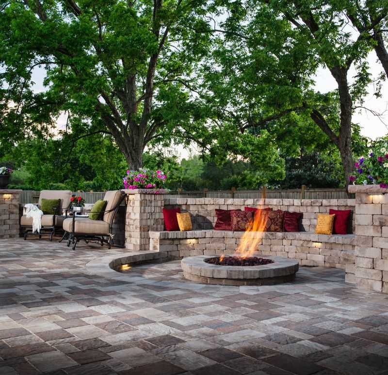 Paver stones outdoor fireplace step wall seating patio