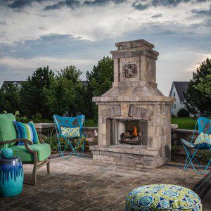 Paver stones outdoor fireplace step wall seating patio