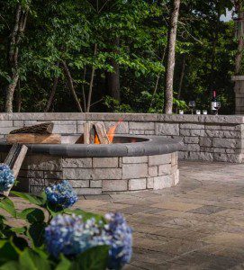 Paver stones outdoor fireplace step wall seating patio