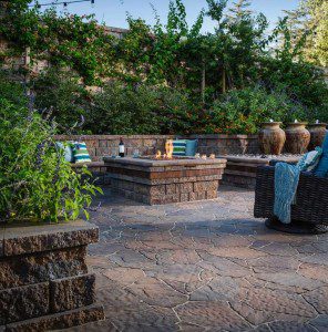 Paver stones outdoor fireplace step wall seating patio