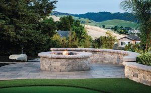 Paver stones outdoor fireplace step wall seating patio