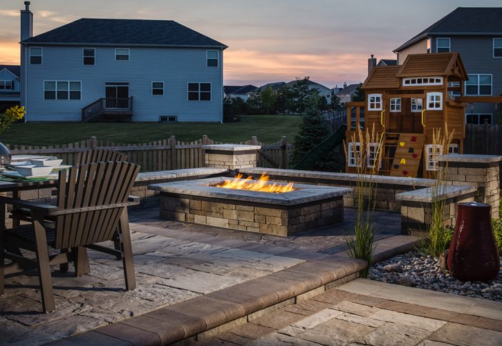 Paver stones outdoor fireplace step wall seating patio