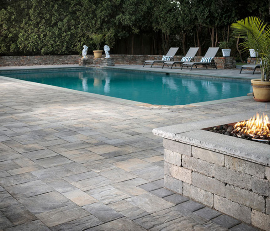 A professionally installed swimming pool with a paver stone pool deck provides endless entertainment possibilities