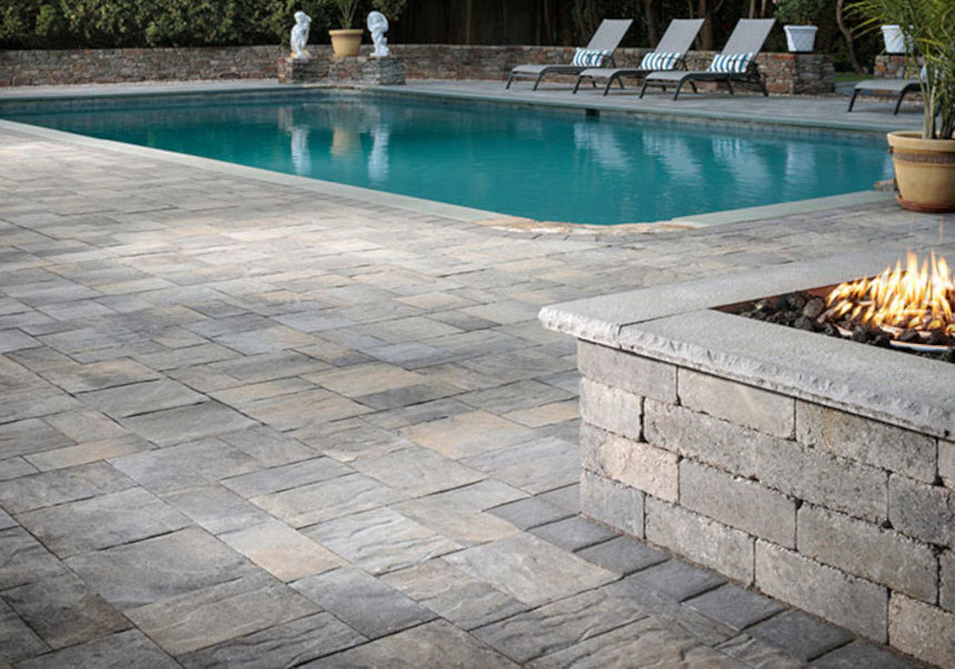 A professionally installed swimming pool with a paver stone pool deck provides endless entertainment possibilities